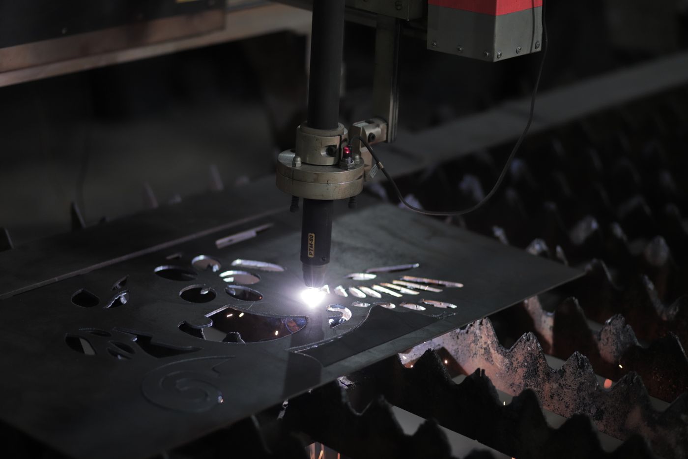 Plasma cutter shaping steel plate in the fabrication shop
